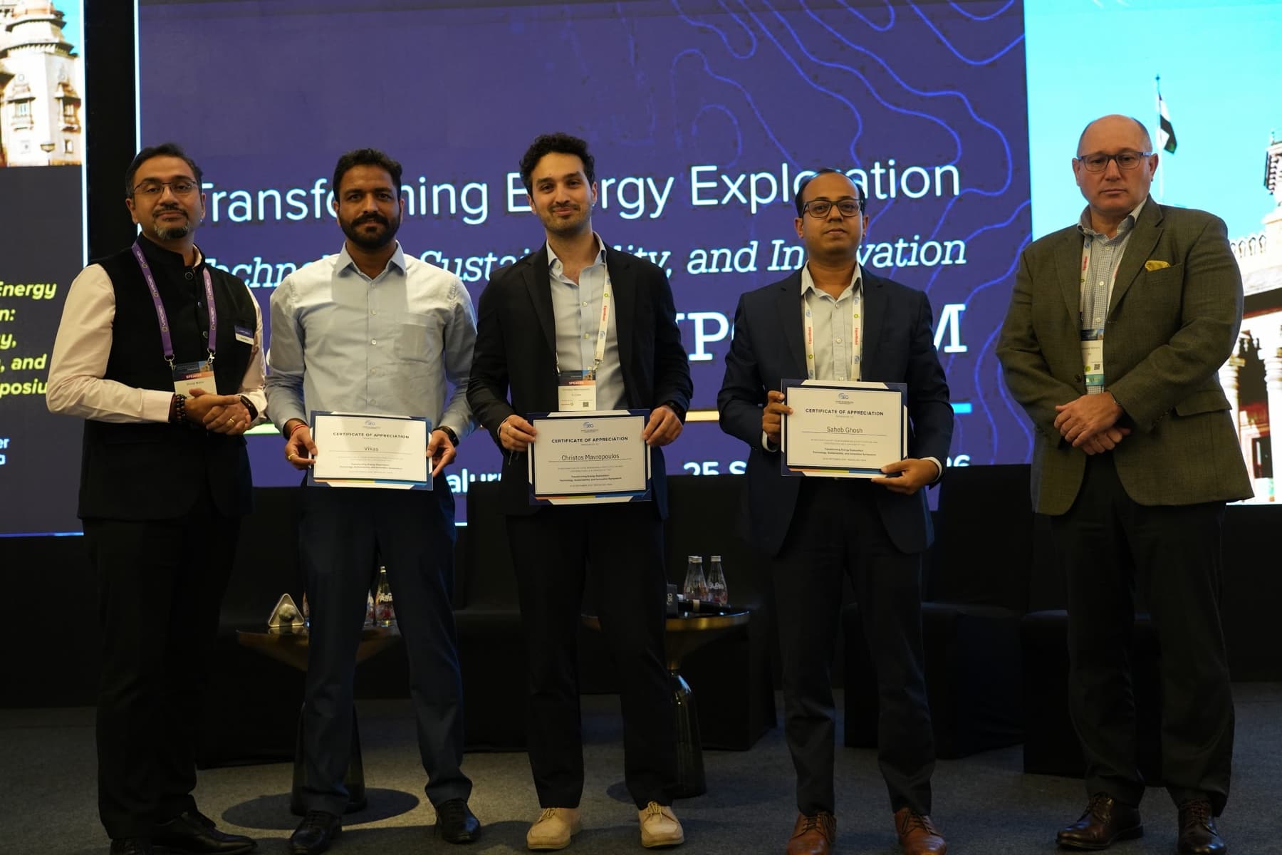 Vikas Vats (S-Cube), Christos Mavropoulos (S-Cube) and Saheb Ghosh (ONGC) receiving SEG certificates of appreciation at the Transforming Energy Exploration Symposium in Bengaluru