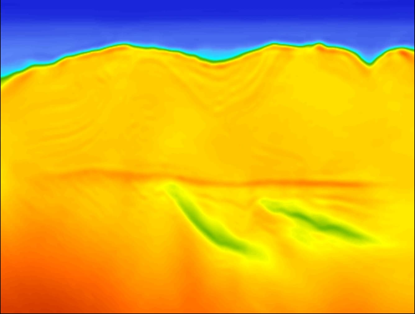 The same cross-line after elastic FWI to 20 Hz, top salt sharply resolved and the sub-salt section recovered